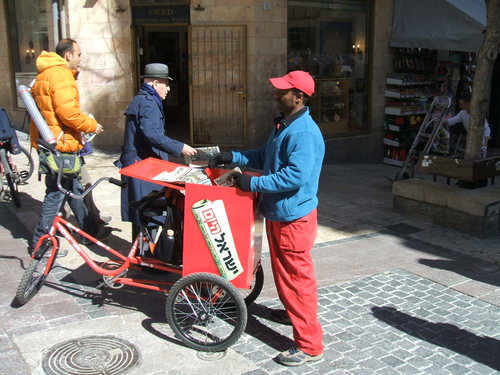 Photo: One of the distinctive newspaper distributors of Sheldon Adelson's Israel Hayom (courtesy Wikimedia)